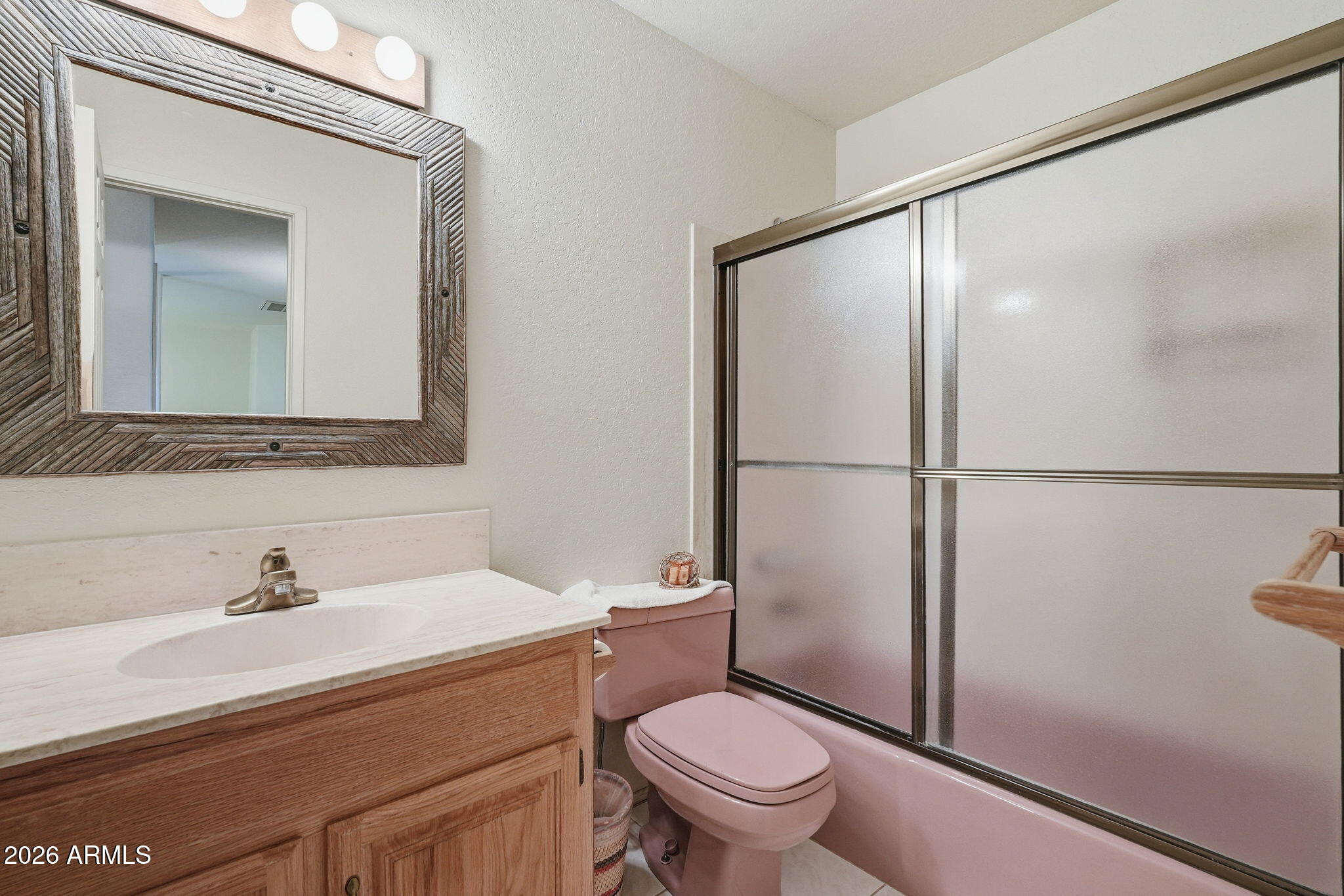 428 Camino Canoa Rio Rico, AZ 85648 - Photo 37 of 56 a bathroom with a sink a mirror a toilet and shower