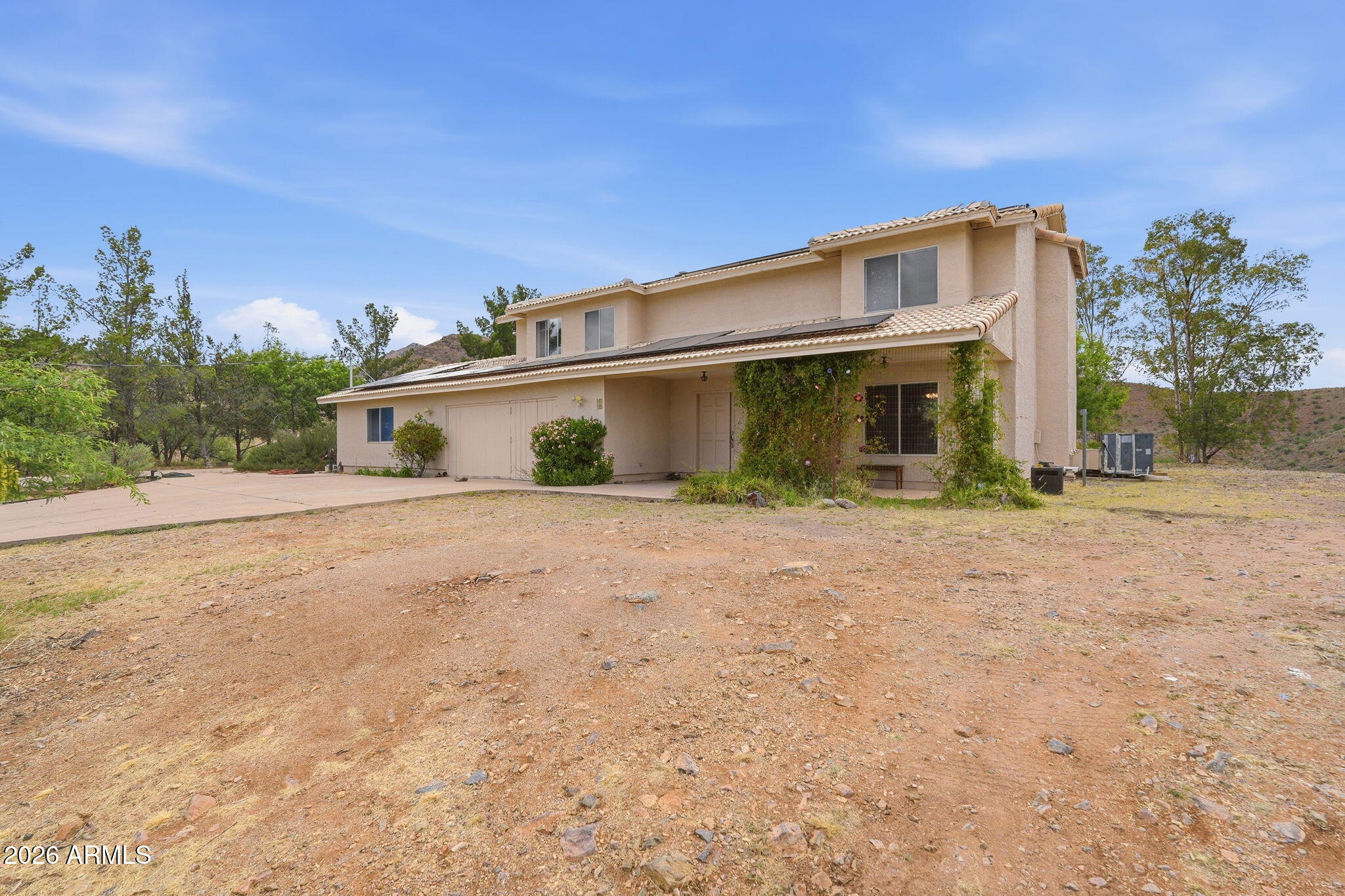 428 Camino Canoa Rio Rico, AZ 85648 - Photo 4 of 56 a front view of a house with a yard