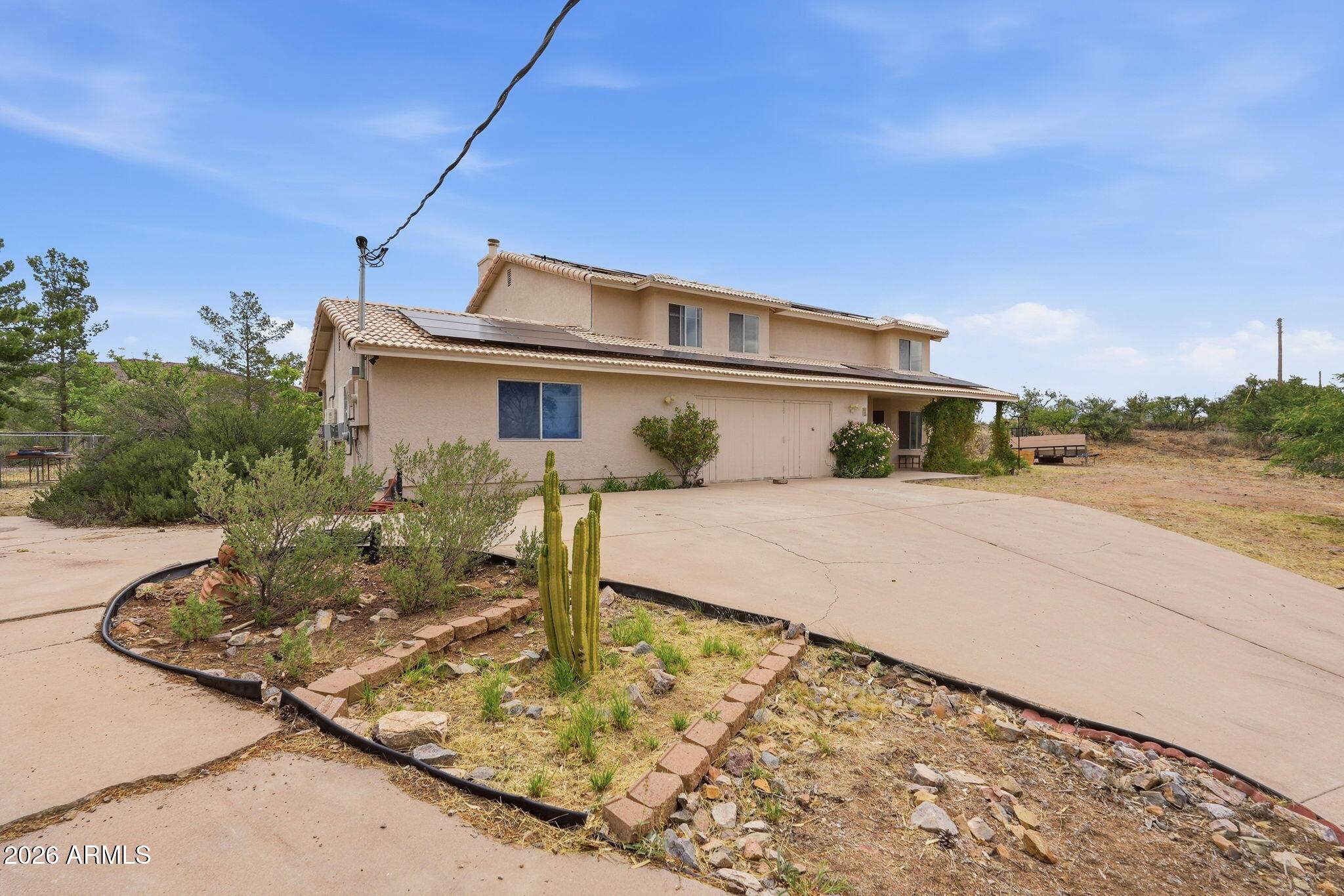 428 Camino Canoa Rio Rico, AZ 85648 - Photo 5 of 56 a front view of a house with garden
