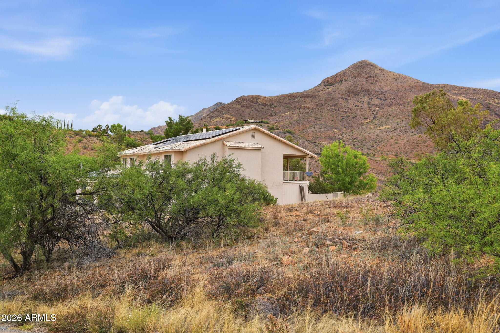428 Camino Canoa Rio Rico, AZ 85648 - Photo 6 of 56 a view of a house with a yard and mountain