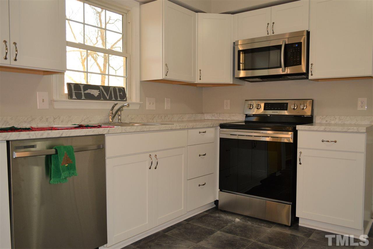 1603 Friendly Road Dunn, NC 28334 - Photo 5 of 24 Including a stainless smooth top stove and microwave.