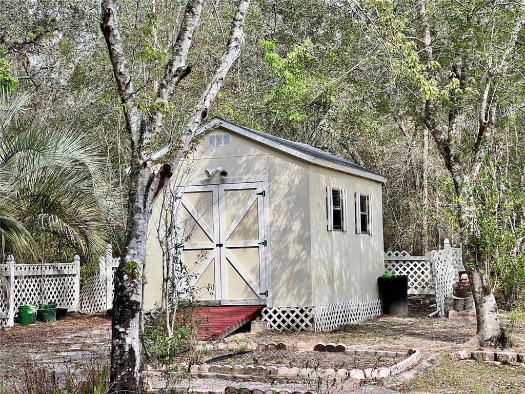 1995 East Newhaven Street Inverness, FL 34453 - Photo 38 of 48 a view of a house with a yard