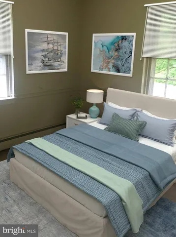 a bedroom with bed and wall painting with wooden floor