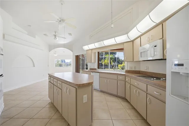 a kitchen with stainless steel appliances granite countertop a sink and cabinets