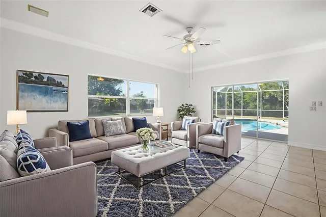 an empty room with a ceiling fan and a window
