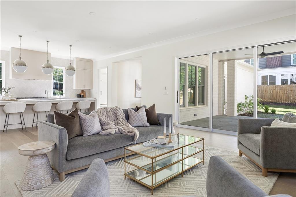 48 25th Atlanta, GA 30328 - Photo 11 of 48 a living room with furniture and a large window