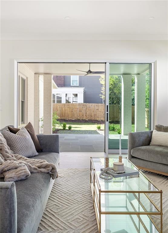 48 25th Atlanta, GA 30328 - Photo 12 of 48 a living room with furniture and a floor to ceiling window