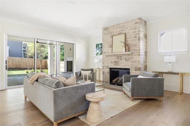 a living room with furniture and a fireplace