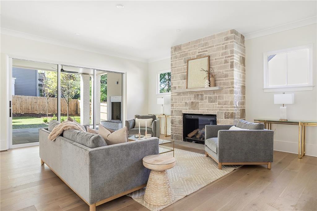 48 25th Atlanta, GA 30328 - Photo 13 of 48 a living room with furniture and a fireplace