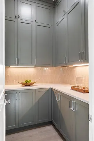 a kitchen with a sink and cabinets