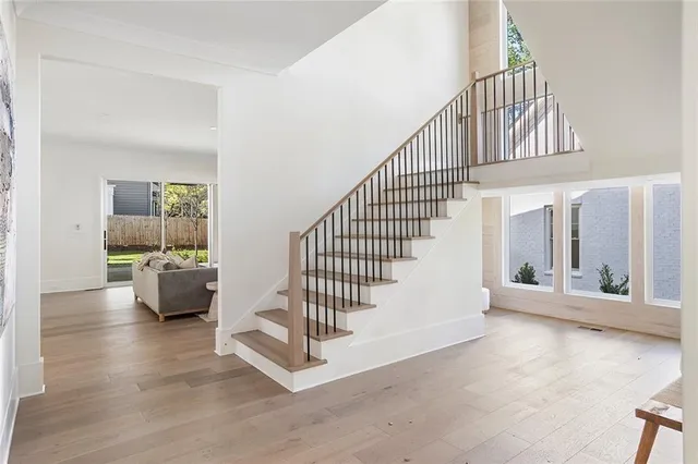 a view of entryway and hall with wooden floor