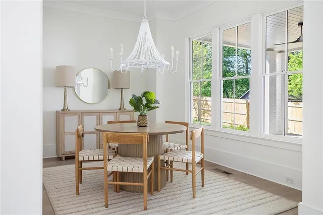 a view of a dining room with furniture window and wooden floor