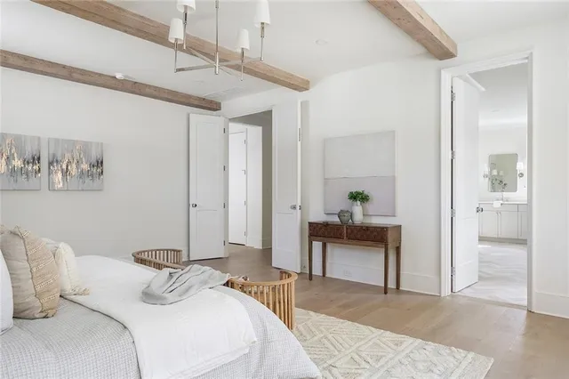 a bathroom with a sink and mirror with toilet