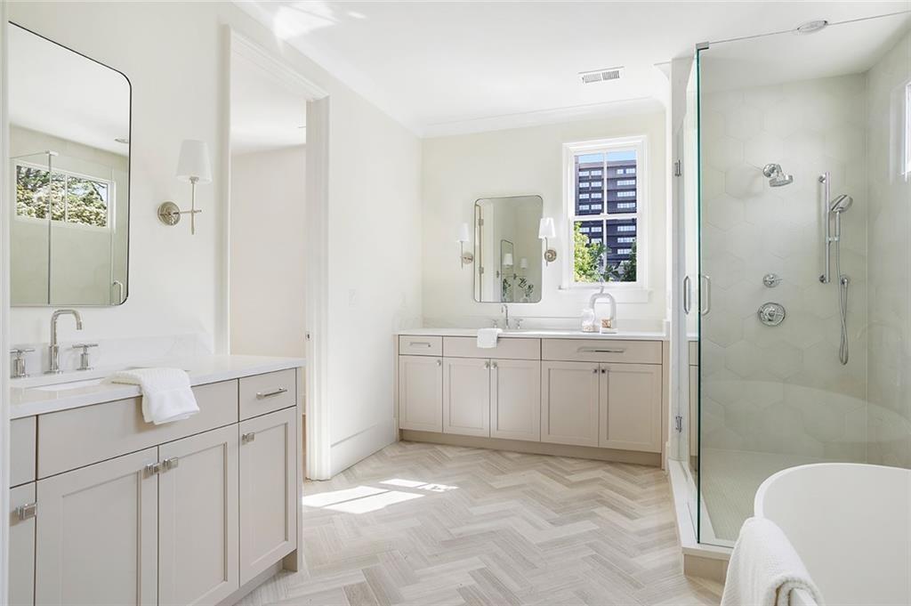 48 25th Atlanta, GA 30328 - Photo 26 of 48 a bathroom with a sink and mirror with toilet