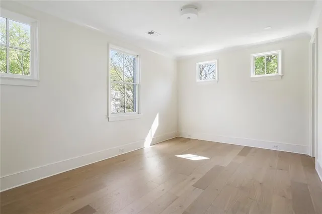 a bathroom with a toilet a sink and a mirror