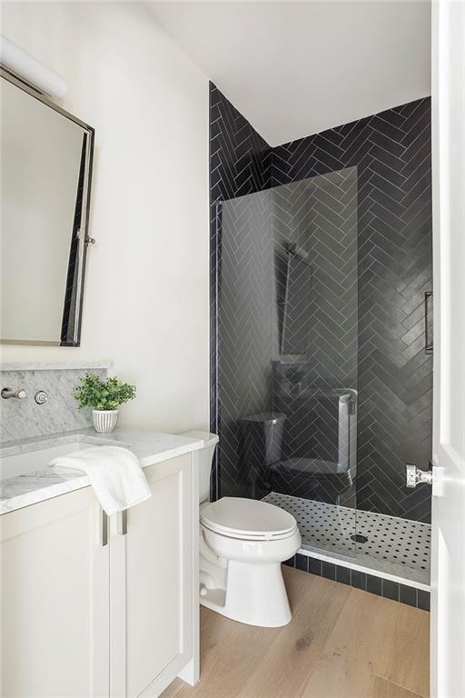 48 25th Atlanta, GA 30328 - Photo 33 of 48 a bathroom with a sink toilet and shower