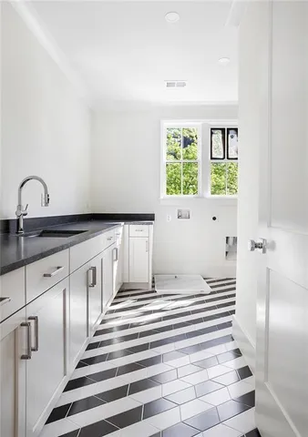 a bathroom with a sink and a window