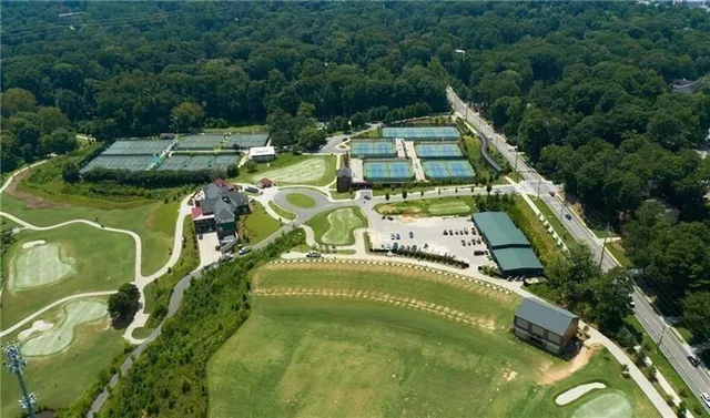 a view of a big yard with lots of green space