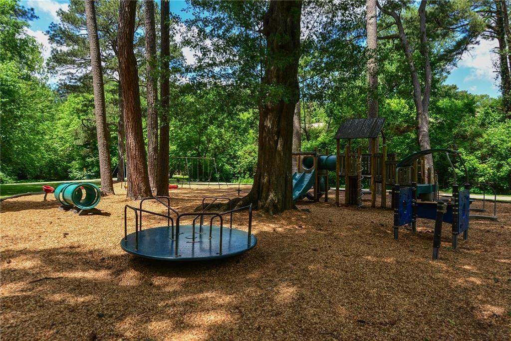 48 25th Atlanta, GA 30328 - Photo 47 of 48 a view of a swimming pool with chairs in patio