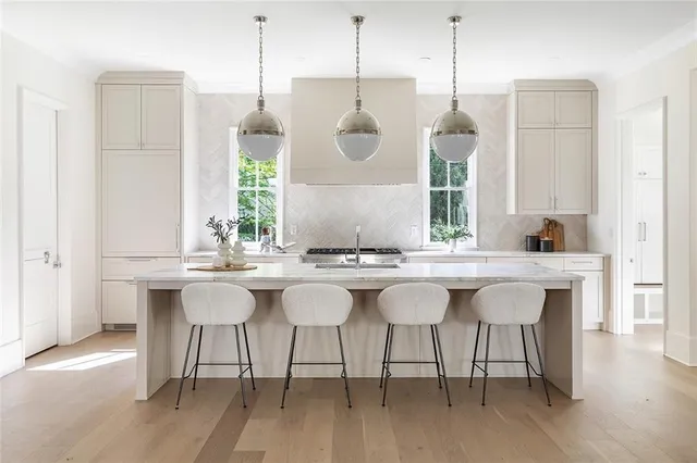 a kitchen with a table and chairs in it