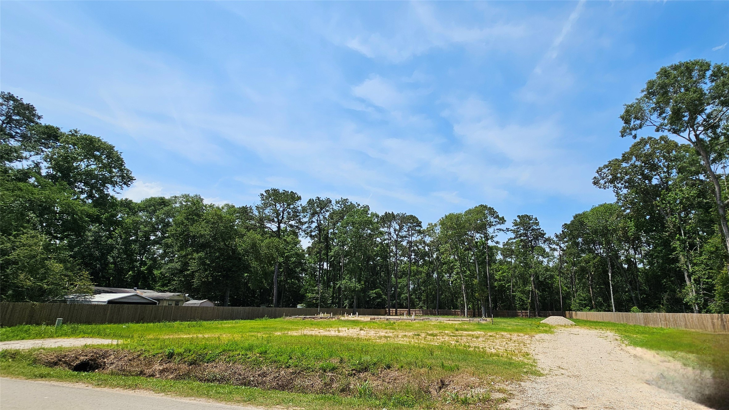 369 County Road 356 New Caney, TX 77357 - Photo 3 of 9 a view of a tennis ground with trees in the background