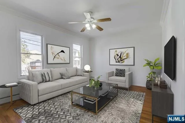 a living room with furniture a flat screen tv and a window