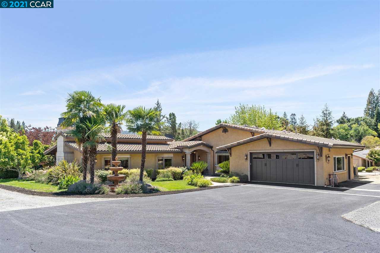999 Livorna Road Alamo, CA 94507 - Photo 1 of 1 a front view of house with a garden and parking space