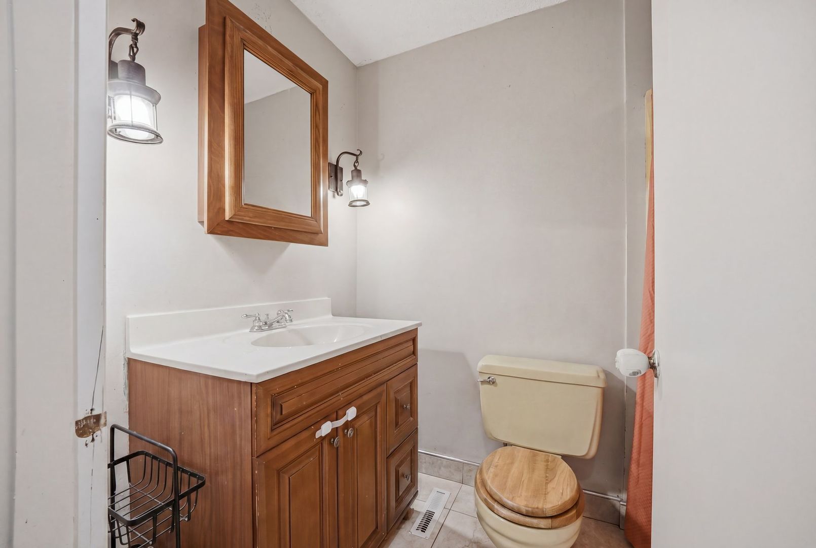 5645 Beebe Drive Rochelle, IL 61068 - Photo 29 of 43 a bathroom with a toilet a sink and a mirror