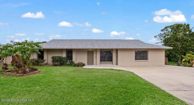 a front view of a house with a garage