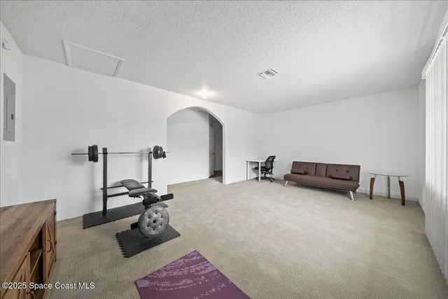 a utility room with wooden floor washer and dryer