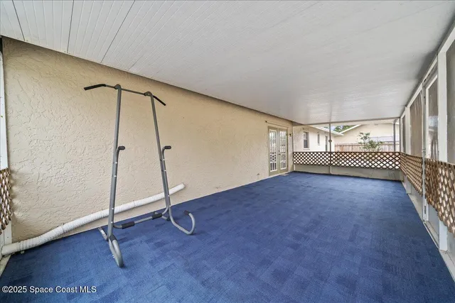 a view of a house with backyard and a sitting area