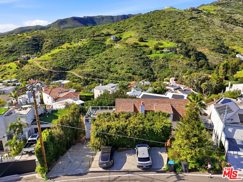 2955 Corral Canyon Road Malibu, CA 90265 - Photo 19 of 21 a view of a large building with a tree