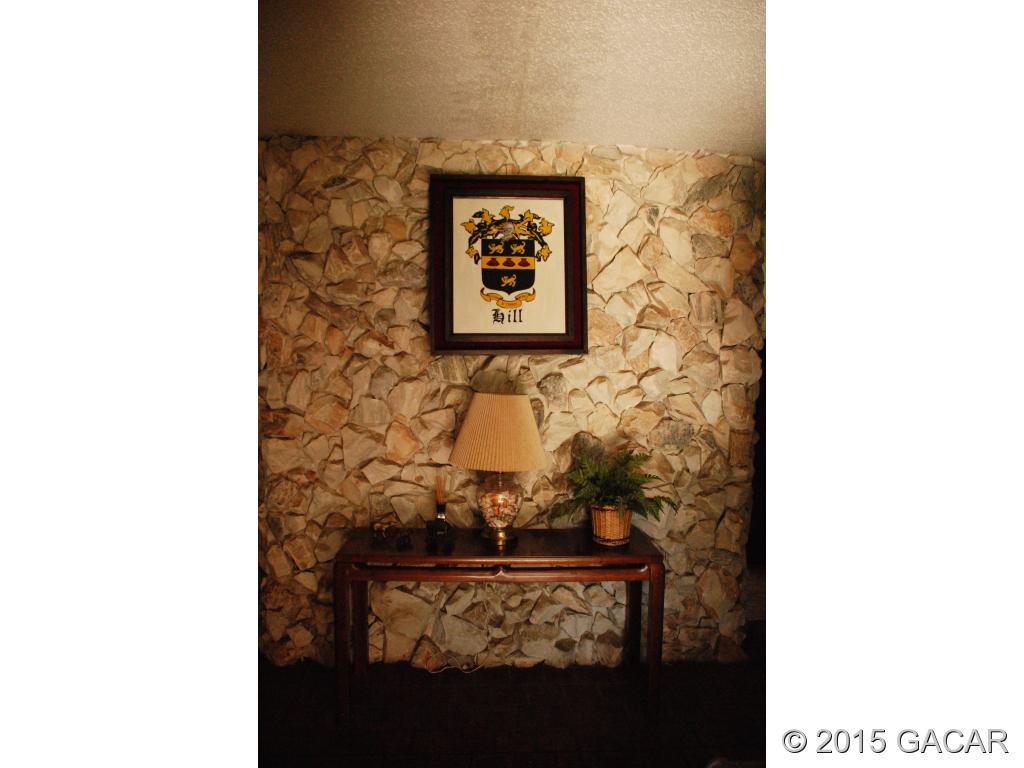 7900 Southwest 8th Avenue Gainesville, FL 32607 - Photo 6 of 24 Foyer has Stone Walls