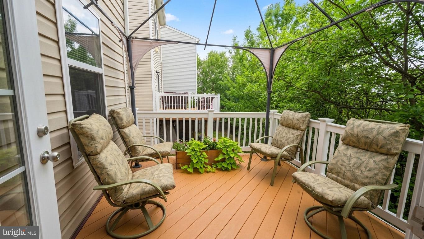17143 Gibson Mill Road Dumfries, VA 22026 - Photo 15 of 35 Serene patio retreat in lush greenery.