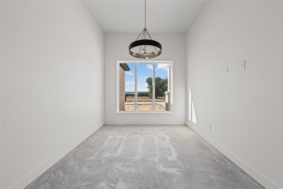 10213 Homesteader Road Gatesville, TX 76528 - Photo 14 of 19 a view of a room with a hanging ceiling fan and window