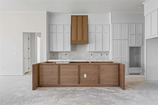 a kitchen that has a sink and a stove in it