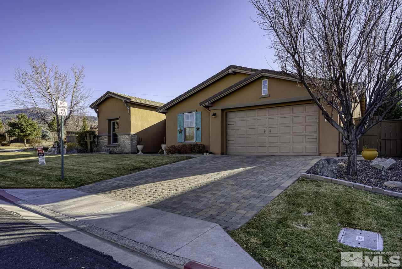 630 Preakness Court Reno, NV 89521 - Photo 2 of 39 a front view of a house with a yard and garage