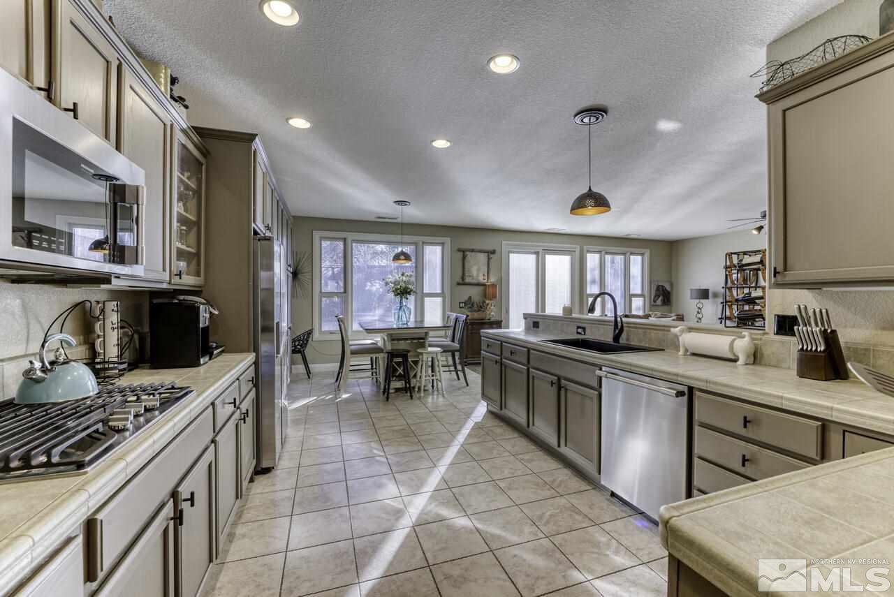 630 Preakness Court Reno, NV 89521 - Photo 4 of 39 a kitchen with lots of counter top space and appliances