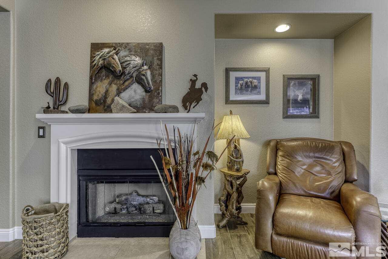 630 Preakness Court Reno, NV 89521 - Photo 9 of 39 a living room with furniture and a fireplace