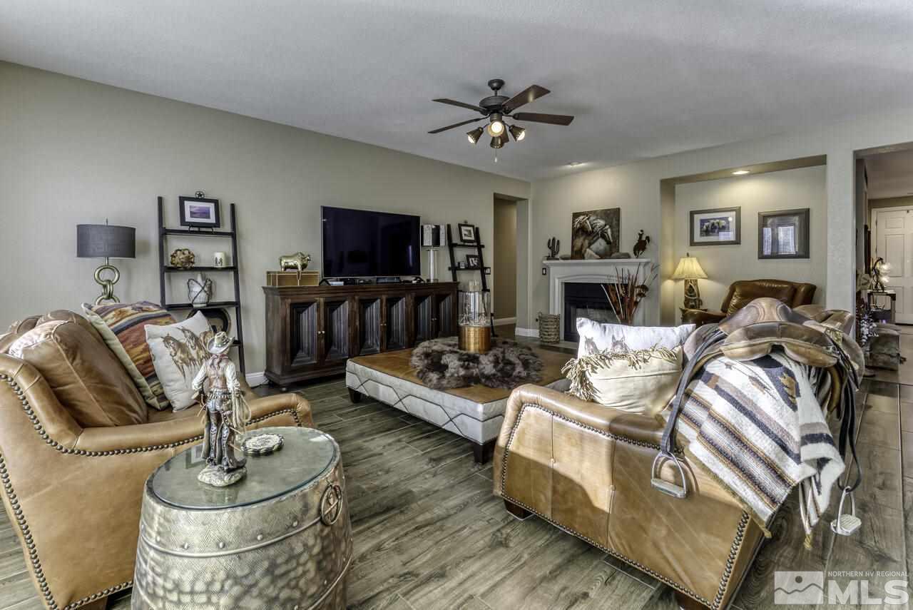 630 Preakness Court Reno, NV 89521 - Photo 10 of 39 a living room with furniture and a flat screen tv