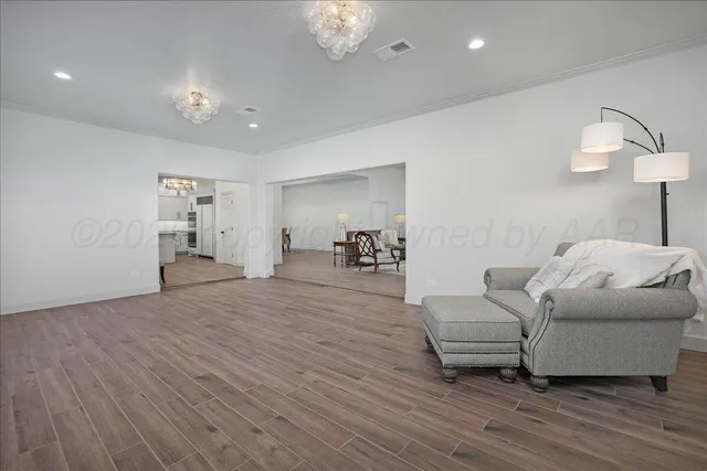 a living room with furniture and a lamp