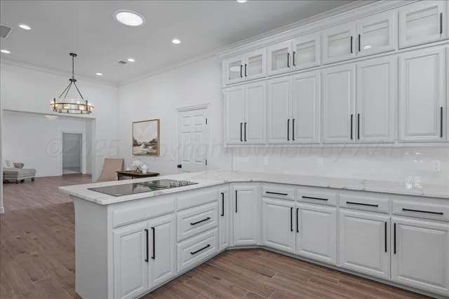 a kitchen that has white cabinets and white appliances