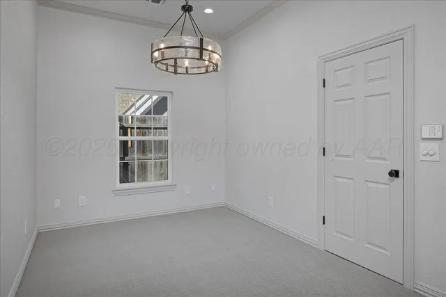 a view of empty room with windows