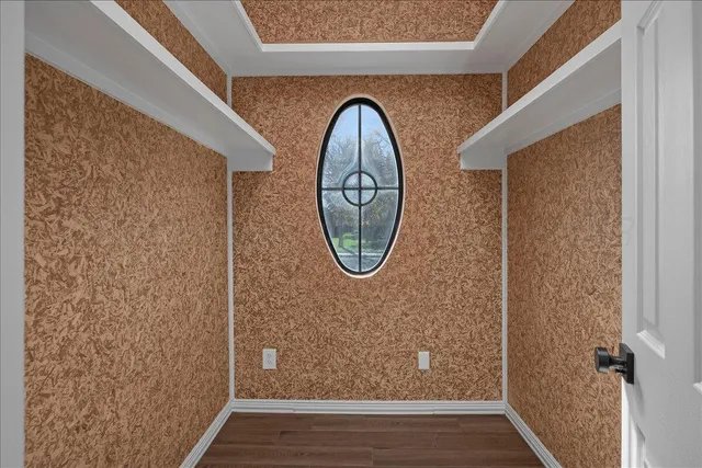 a view of a chair and table in backyard of the house