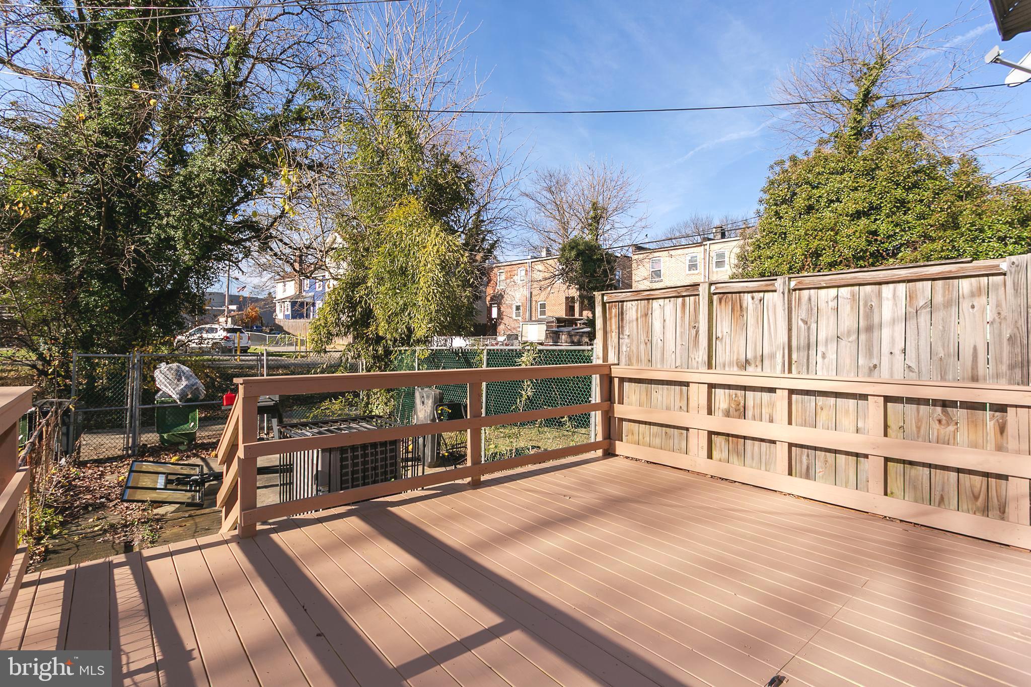 5646 Govane Avenue Baltimore, MD 21212 - Photo 15 of 17 a view of a balcony with wooden floor and fence