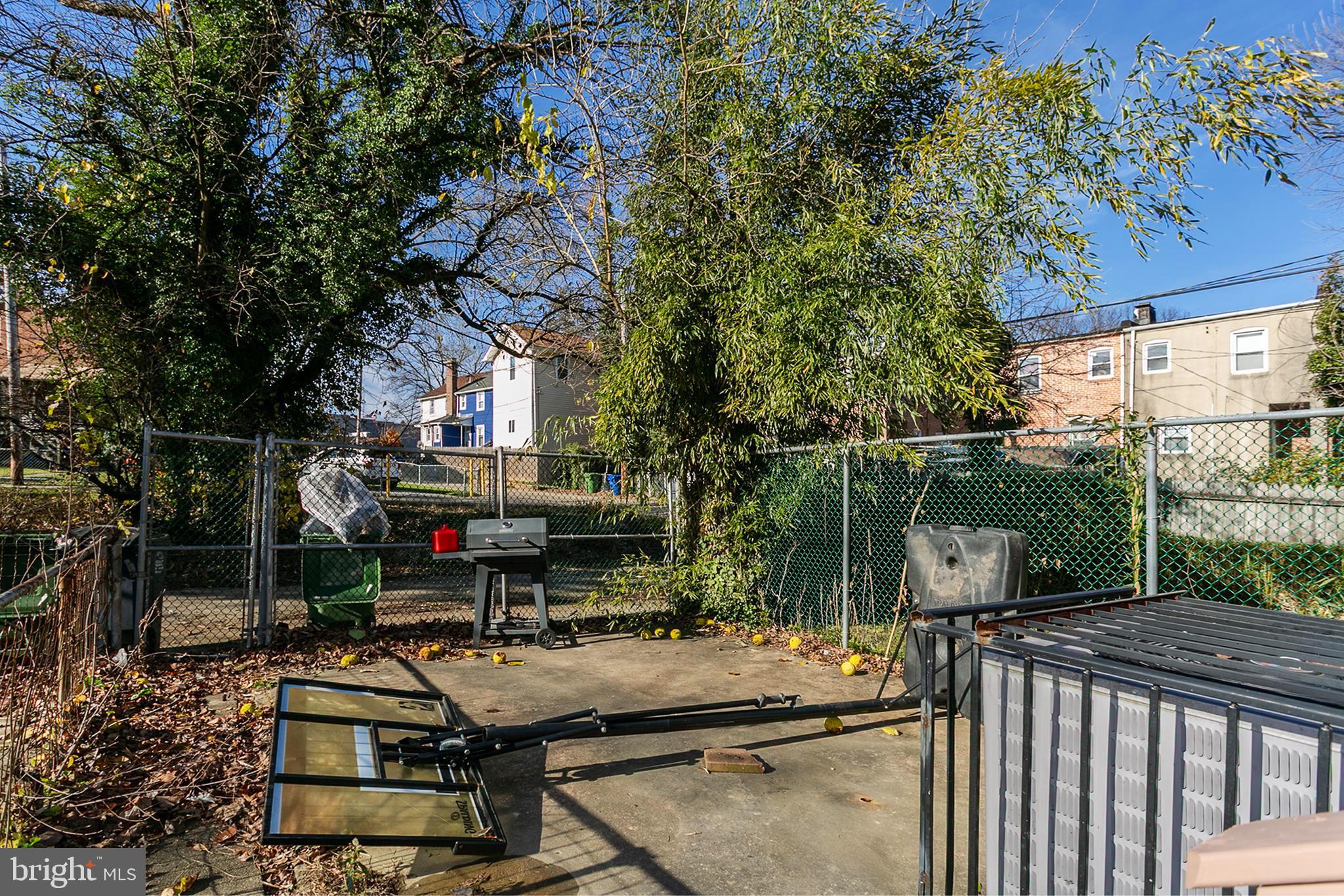 5646 Govane Avenue Baltimore, MD 21212 - Photo 17 of 17 a view of a patio with couches table and chairs and potted plants