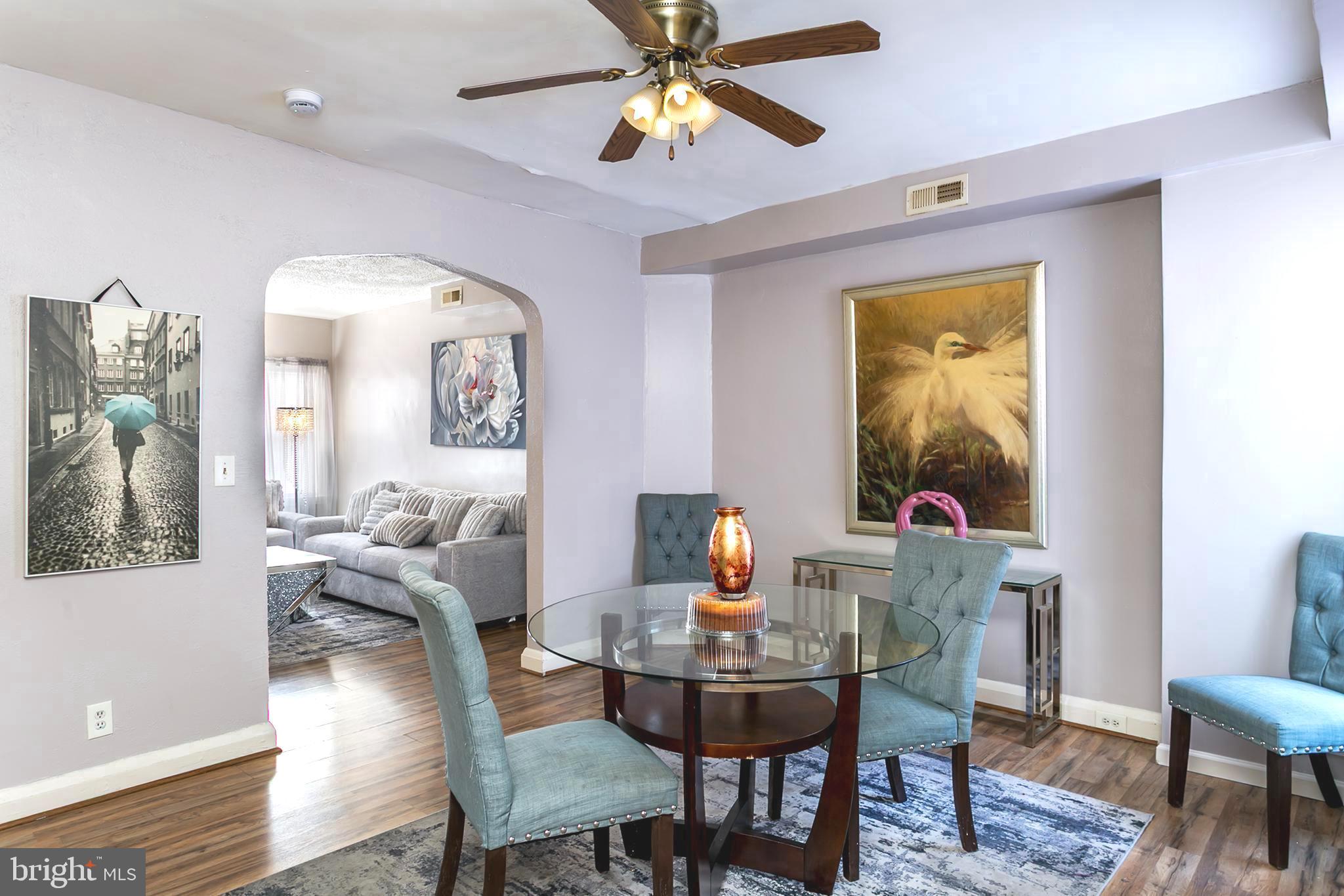 5646 Govane Avenue Baltimore, MD 21212 - Photo 6 of 17 a view of a dining room with furniture and a chandelier