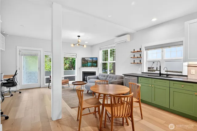 a dining room with kitchen island granite countertop furniture and a sink