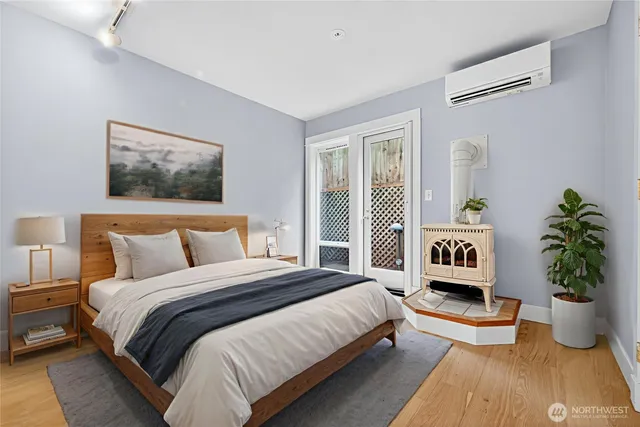 a bedroom with a bed and a potted plant