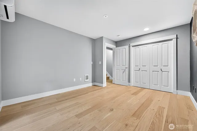 a room with a bed and a window